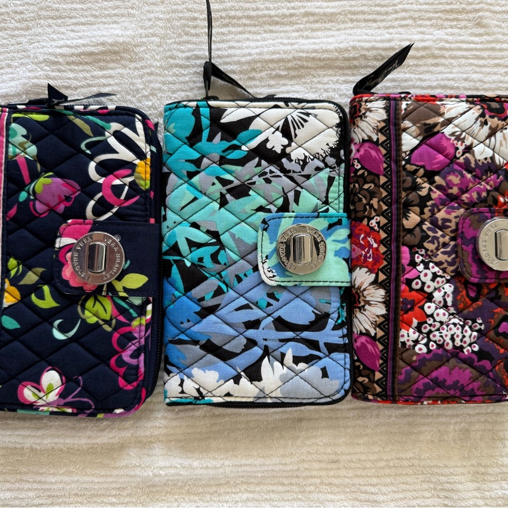 Vera Bradley Turnlock wallet (3) . It has stains in the wallet’s ID plastic